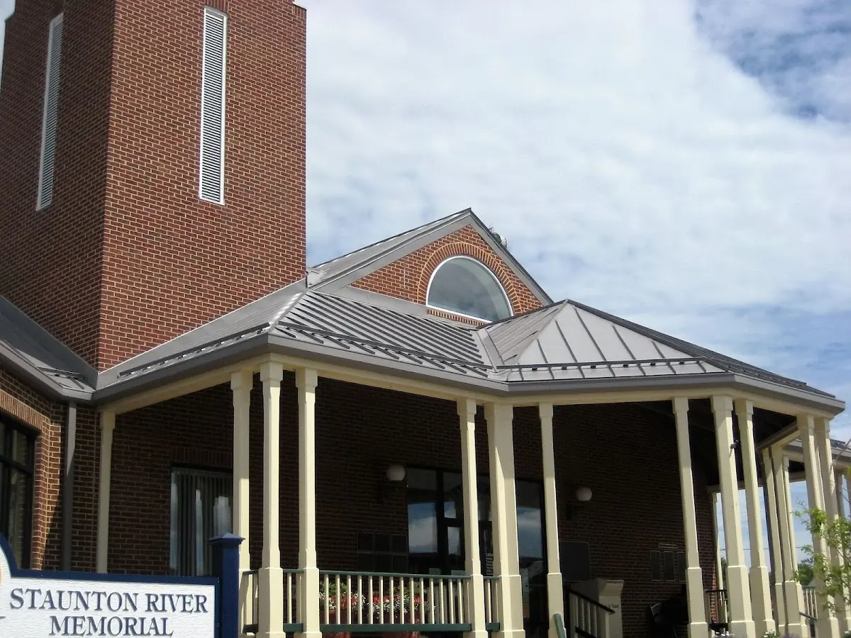 Skilled roofing craftsmen working on a residential roof in Langley Park